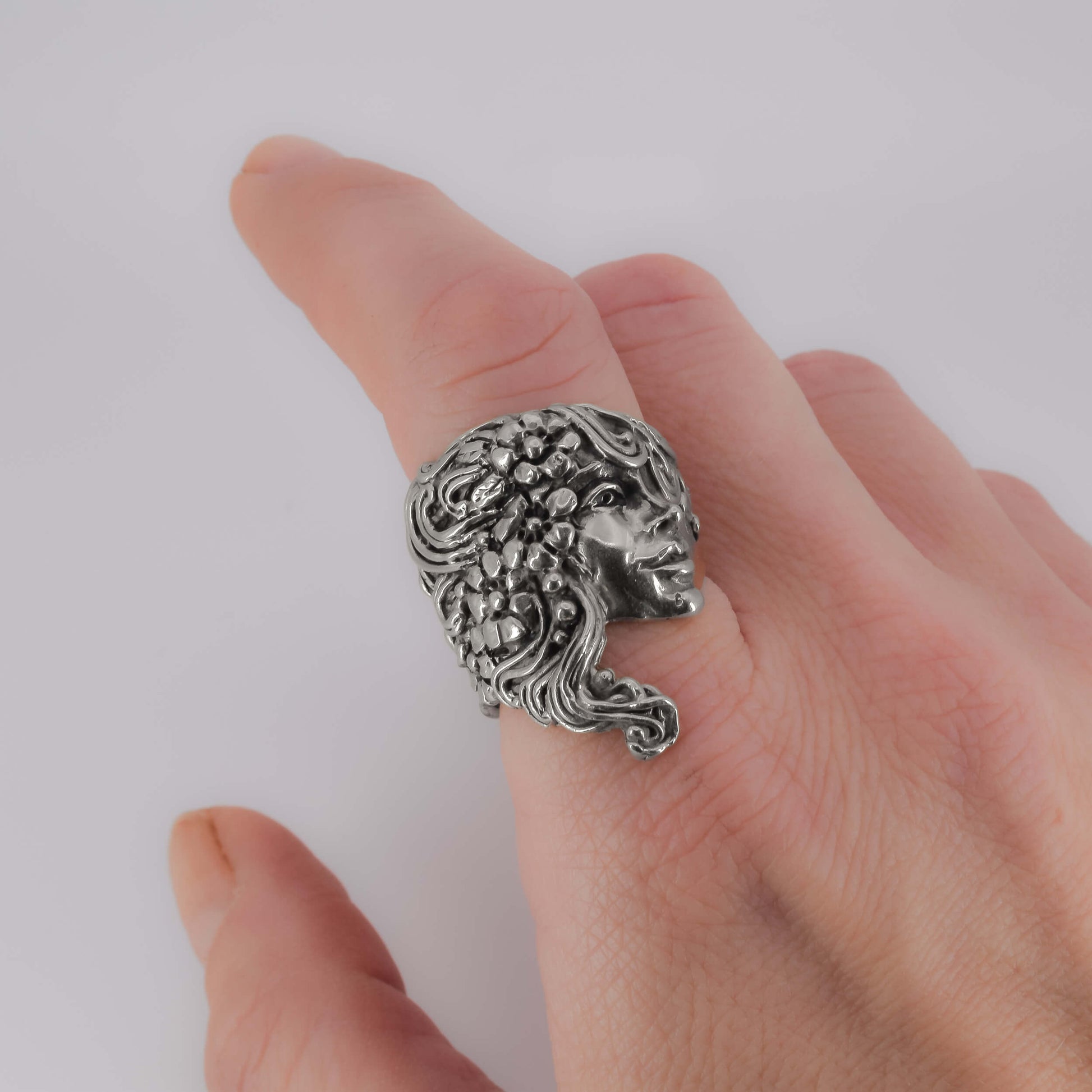 Face with Flowers Ring in Sterling Silver worn on finger