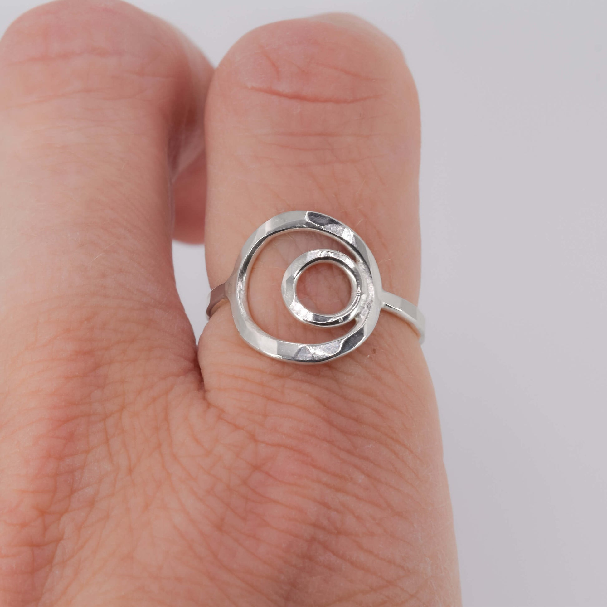 Sterling Silver Nested Circle Ring worn on finger - Jeanine Erickson