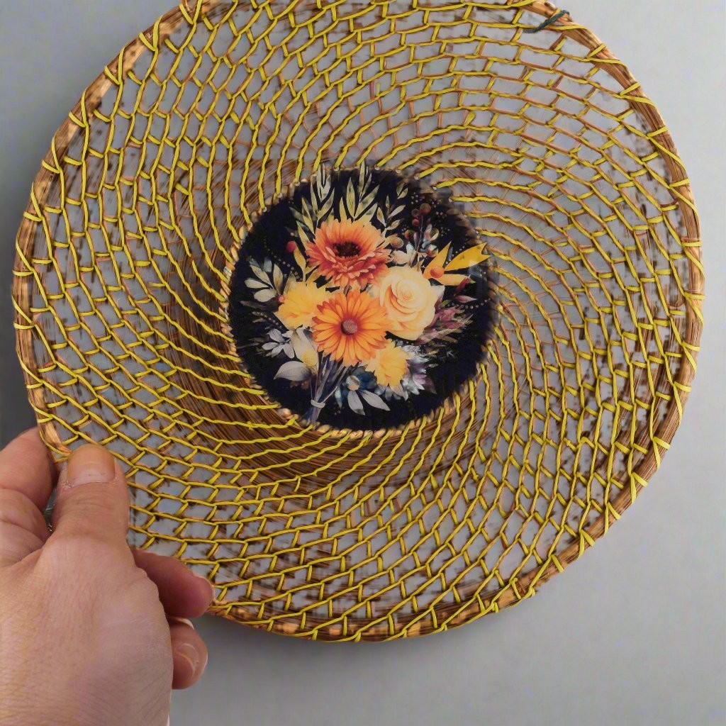 pine needle basket shown in hand for scale and for the floral bouquet details